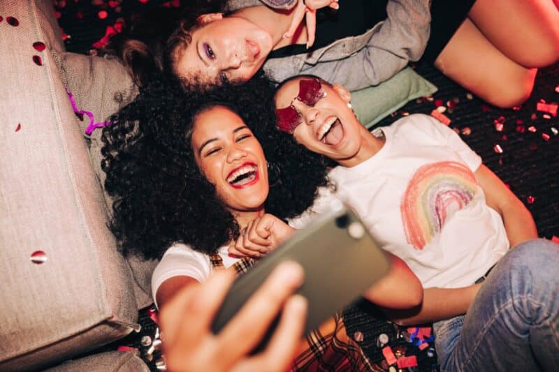 Vibrant,Selfies,For,Vibrant,People.,Overhead,View,Of,Three,Happy